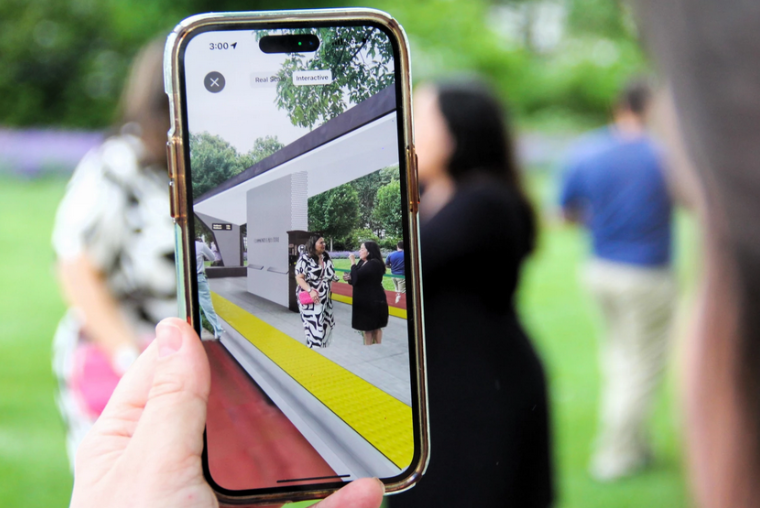 Image of the augmented reality showing the future of a bus stop in the current undeveloped area.
